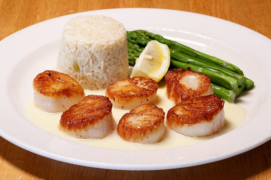 pan seared scallops with rice and vegetable of the day