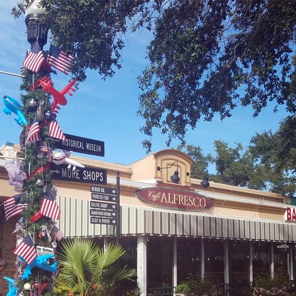 Lamp Post on Main Street in Dunedin, Florida decorated with Patriotic Cheer, American Flags and Red, White and Blue Planes