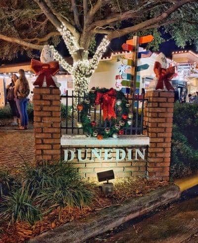 Dunedin, Florida welcome sign decorated with holiday wreath