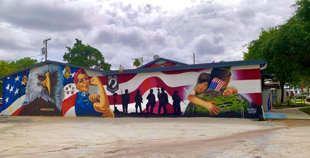 The Dunedin VFW mural featuring American iconography including a bald eagle, Rosie the Riveter, and a US Army soldier